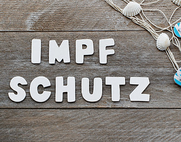 Bild mit Aufschrift Impfschutz